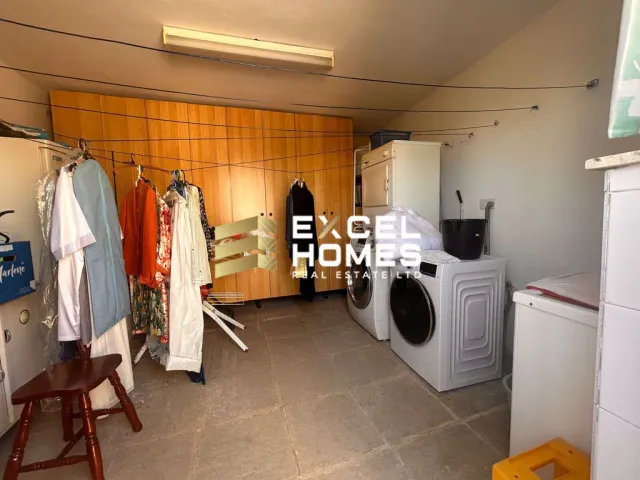 a kitchen with a refrigerator, stove, and a stove top oven