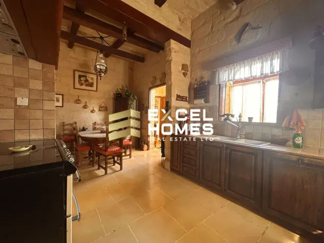 a kitchen with a large window and a large counter