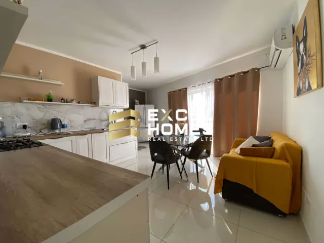 a living room with a couch, table, chairs and a table 