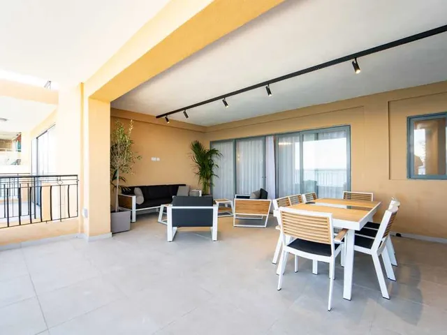 a dining room with a table and chairs