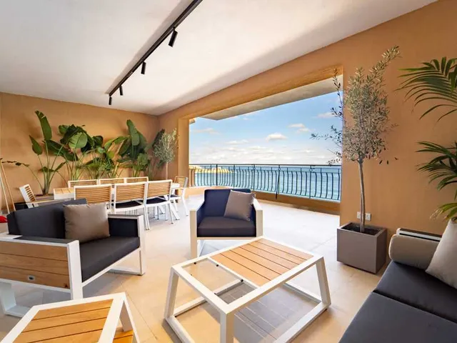 a large room with a large balcony and a large window