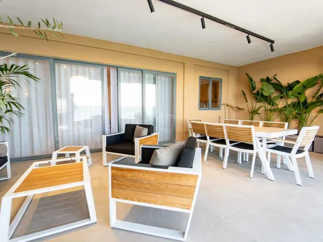 a living room with a table and chairs