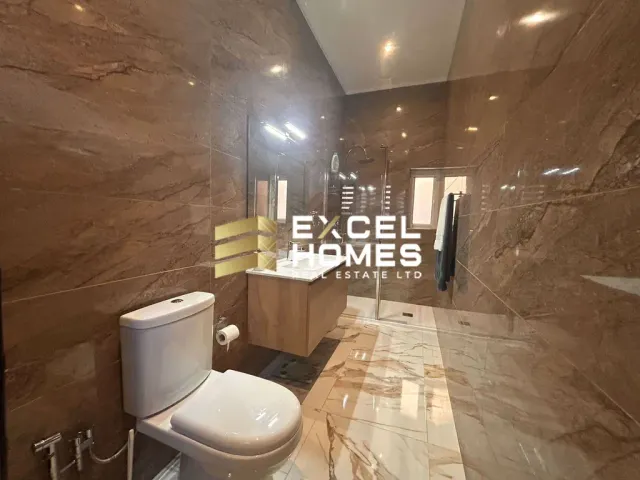 a bathroom with a toilet and a sink