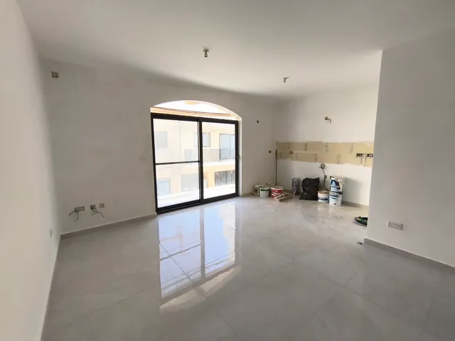a room with a white wall and a white floor