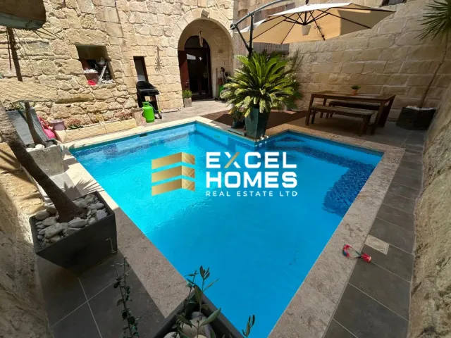 a pool with a blue chair and a blue chair