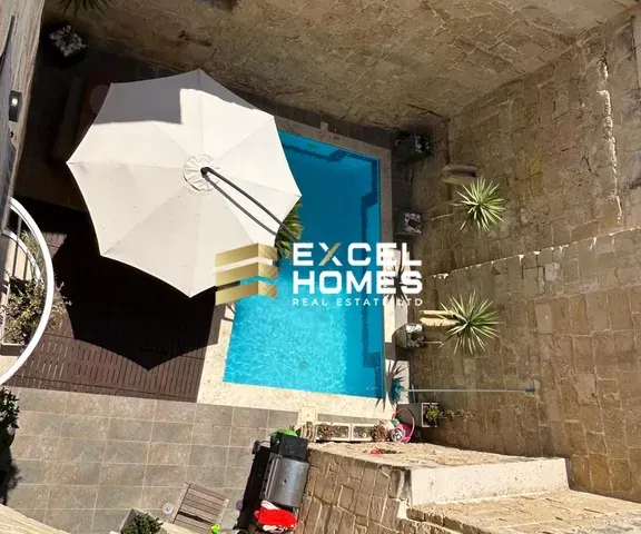 a white umbrella sitting under a blue umbrella