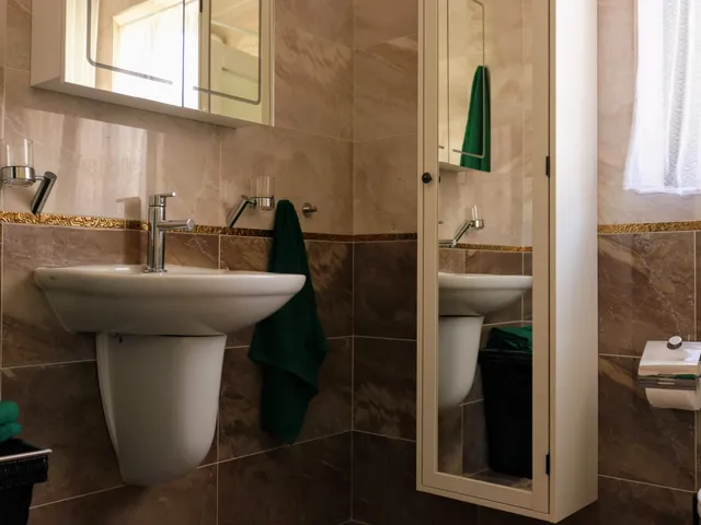 a bathroom with a sink, toilet and tub