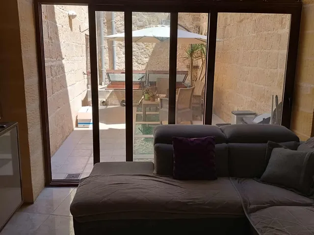 a living room with a couch and a table