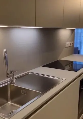 a kitchen sink with a stainless steel counter top