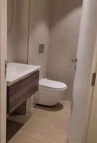 a bathroom with a toilet, sink, and bathtub