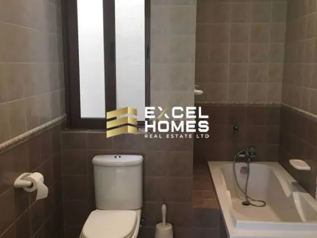 a bathroom with a toilet, sink, and bathtub