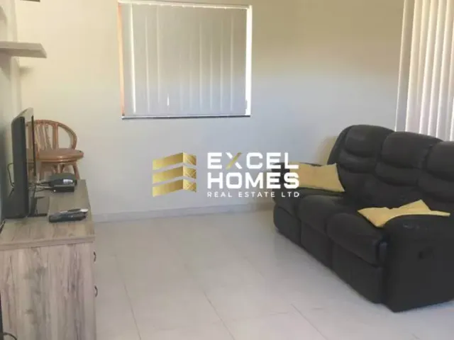 a couch and a chair in a room